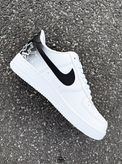 Side profile of handmade Nike Air Force 1 custom sneakers with realistic Tupac portrait and black Nike Swoosh detail