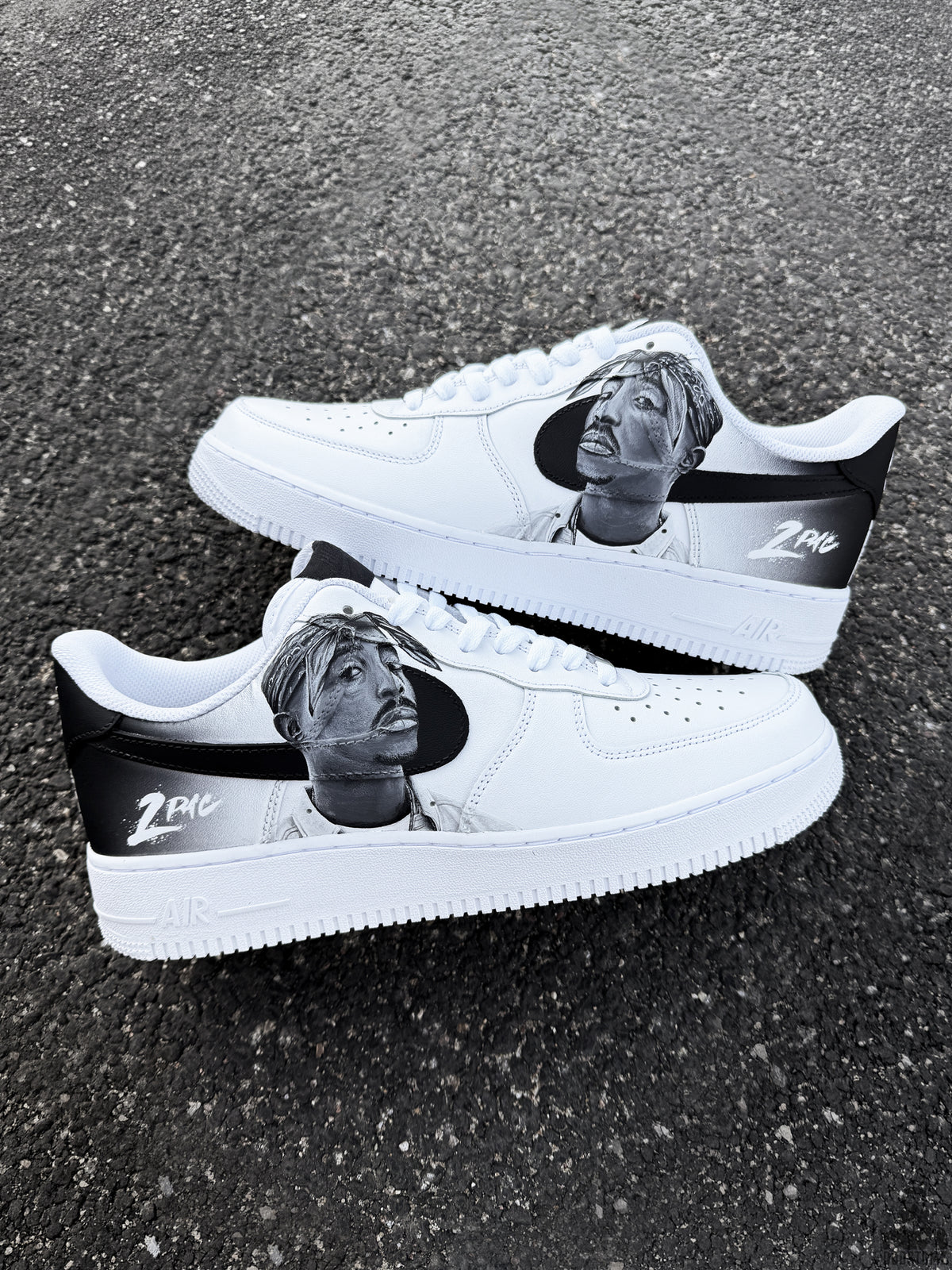 Custom Nike Air Force 1 sneakers with realistic hand painted Tupac portrait, black Nike Swoosh and unique black and white sneaker artwork