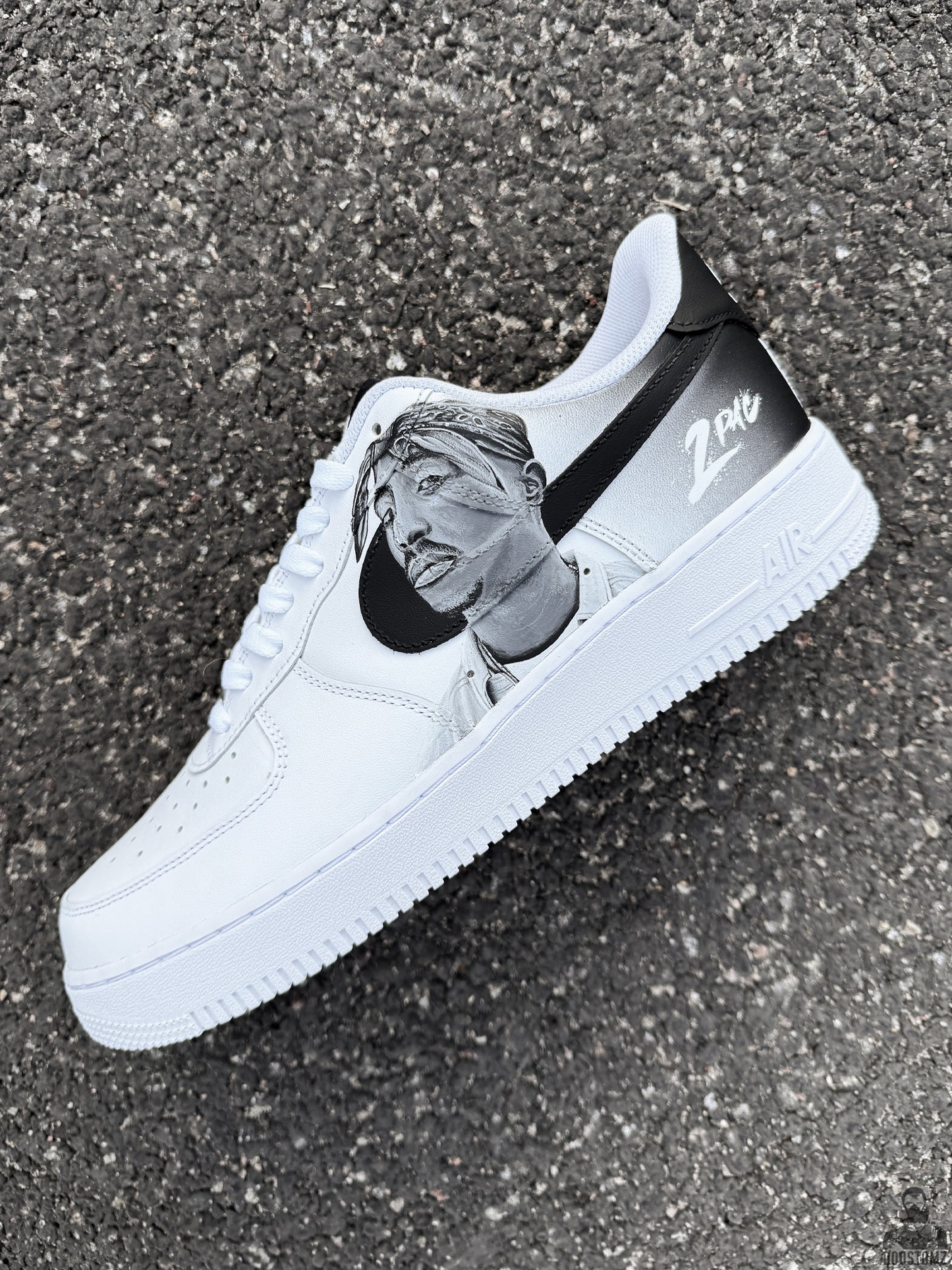 Custom Nike Air Force 1 Low sneakers with detailed black and white Tupac portrait painting and personalized sneaker artwork
