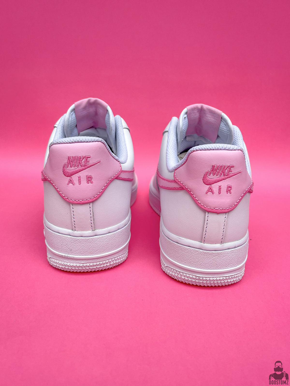 Custom Nike Air Force 1 Hello Kitty sneakers showing the rear design with pink and white hand-painted details
