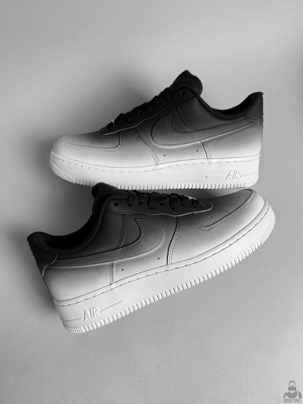Custom Nike Air Force 1 sneakers with hand-painted black and white gradient