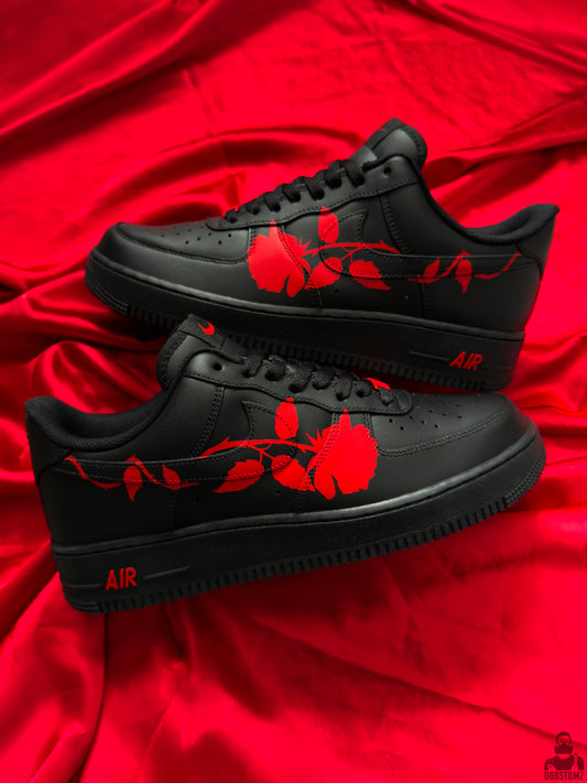 Black Nike Air Force 1 custom sneakers with hand-painted red roses on both shoes