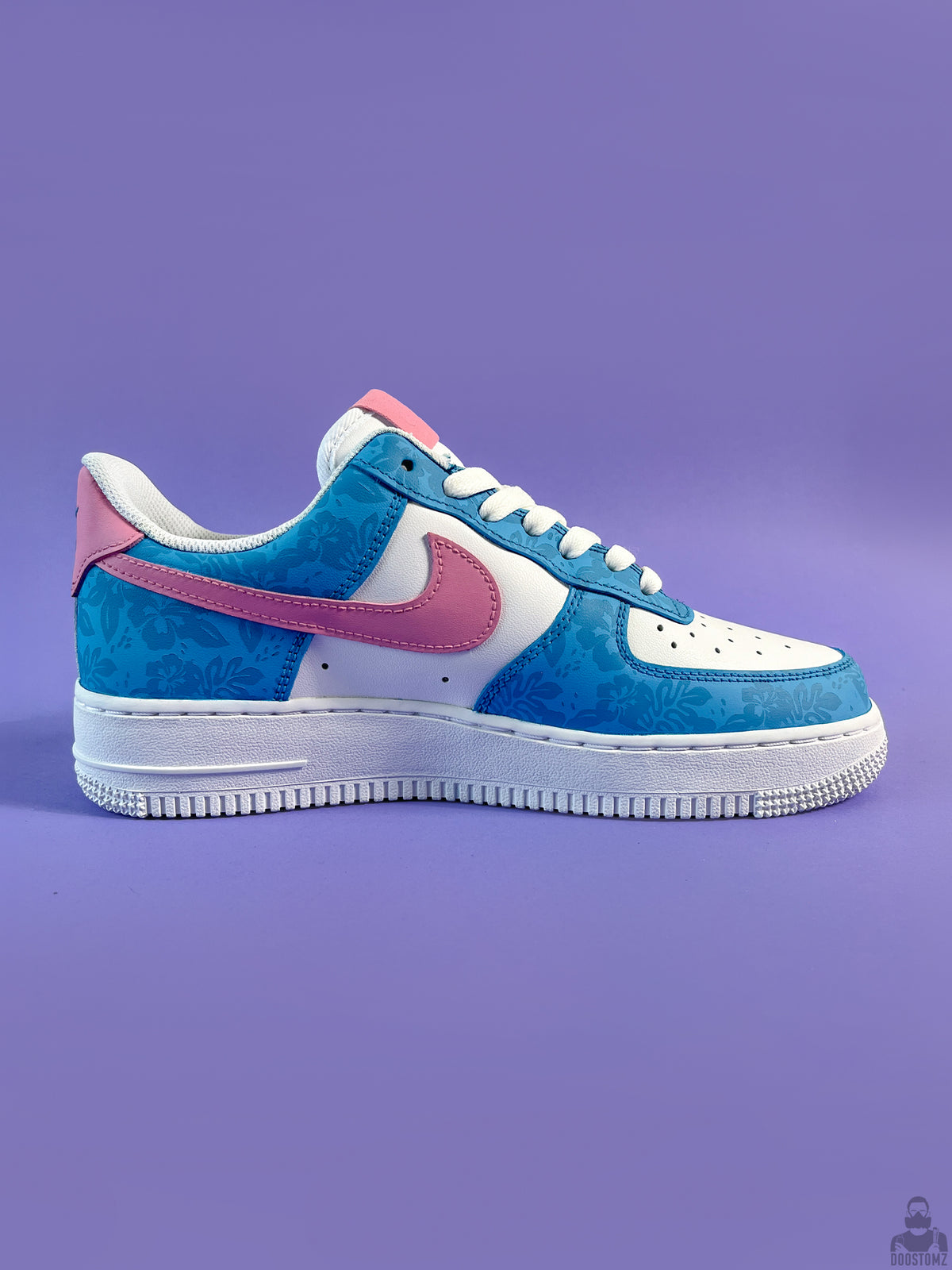 Lilo & Stitch custom Nike Air Force 1 with blue floral pattern and pink Swoosh