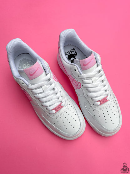 Top view of custom Nike Air Force 1 Hello Kitty sneakers with pink artwork, white laces and personalized details