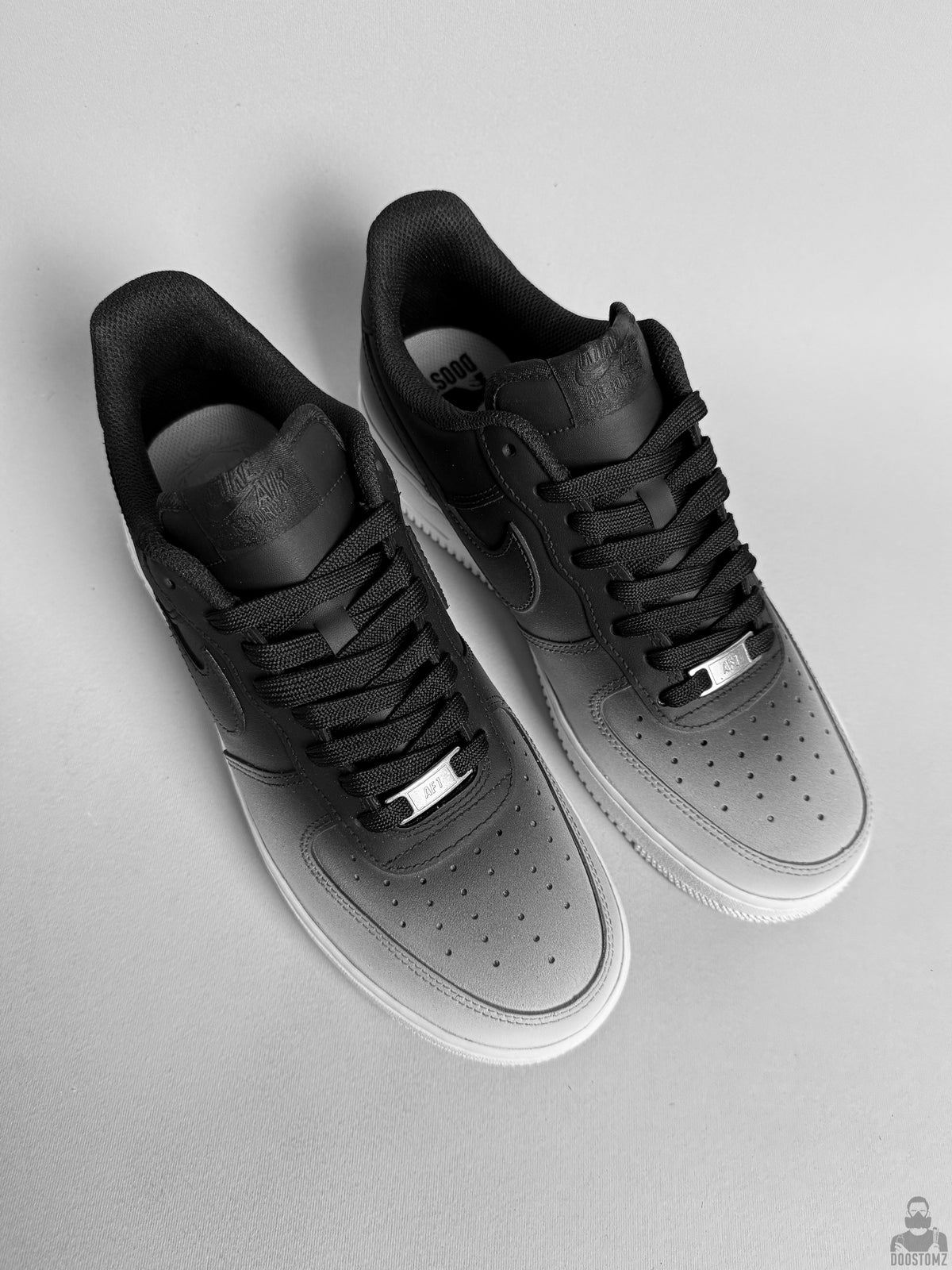 Black and white Nike Air Force 1 custom sneakers viewed from above