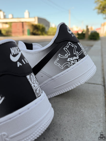 Back view of custom Nike Air Force 1 sneakers featuring black heel panels, white Nike Air branding and hand painted graphic details