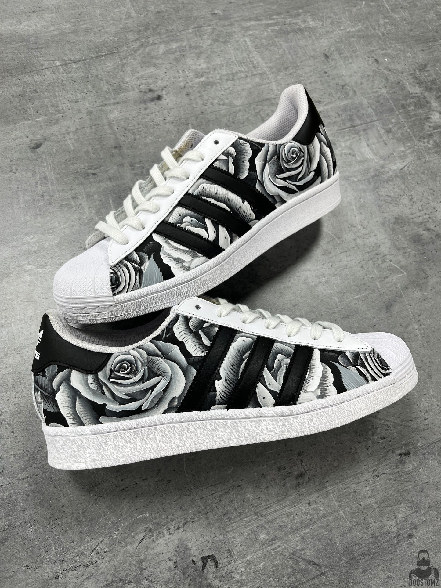 Hand-painted Adidas Superstar Black & White Roses Custom sneakers featuring realistic black and white roses across the upper