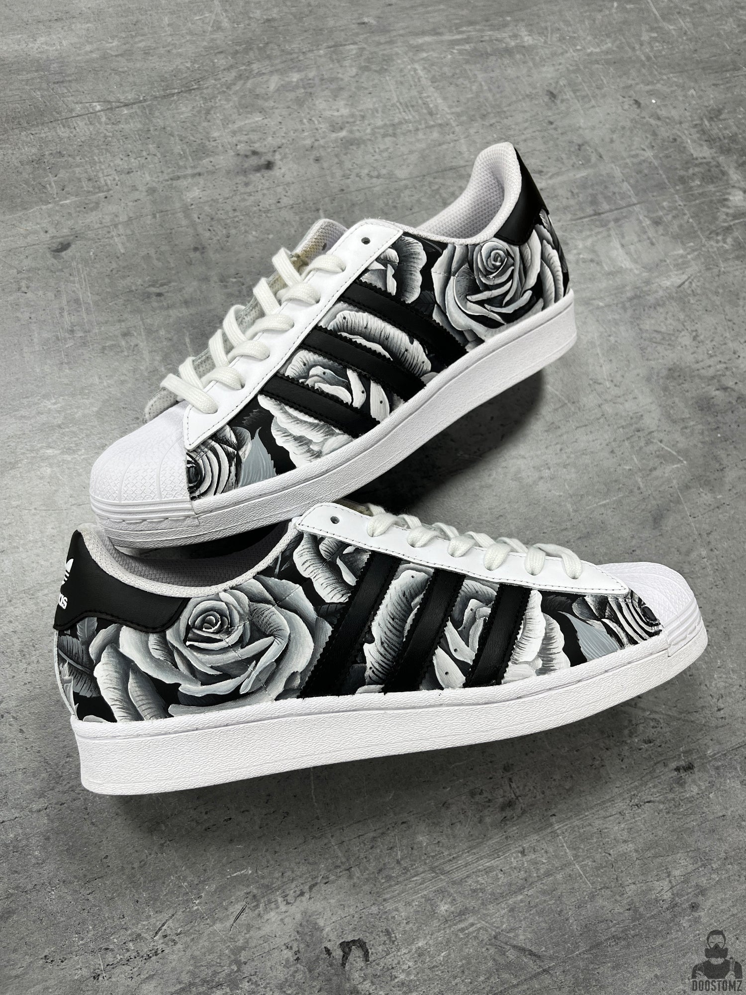 Hand-painted Adidas Superstar Black & White Roses Custom sneakers featuring realistic black and white roses across the upper
