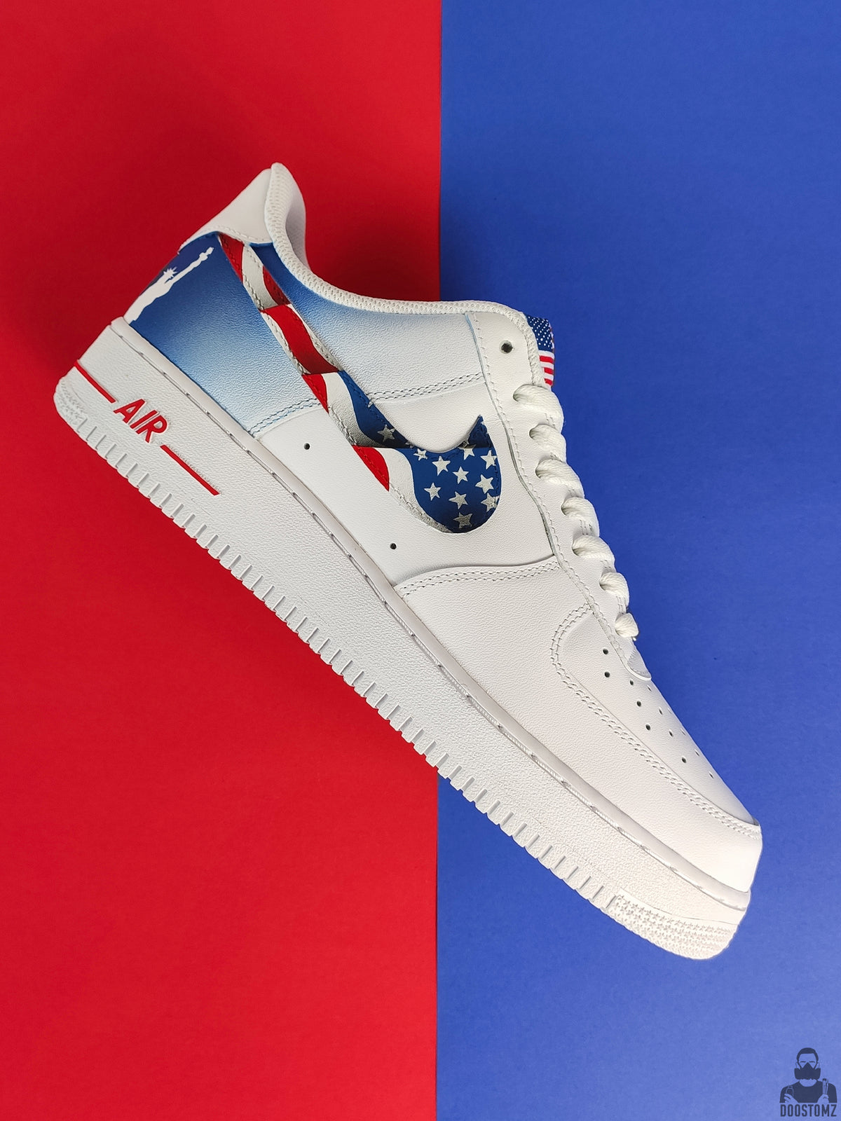 Close-up of American flag stars and stripes hand-painted on Nike Air Force 1 Sneakers