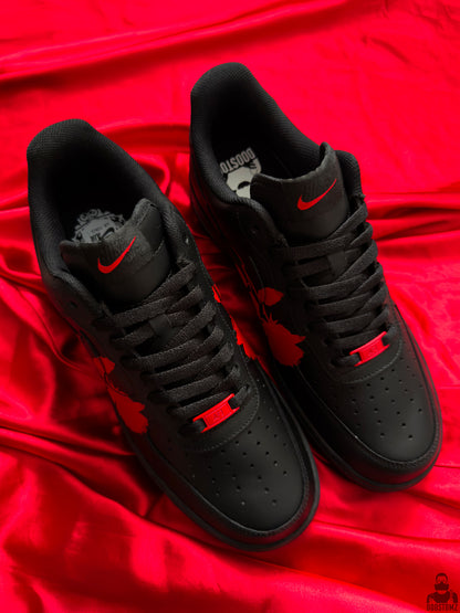Black custom Nike Air Force 1 sneakers with red rose artwork viewed from above