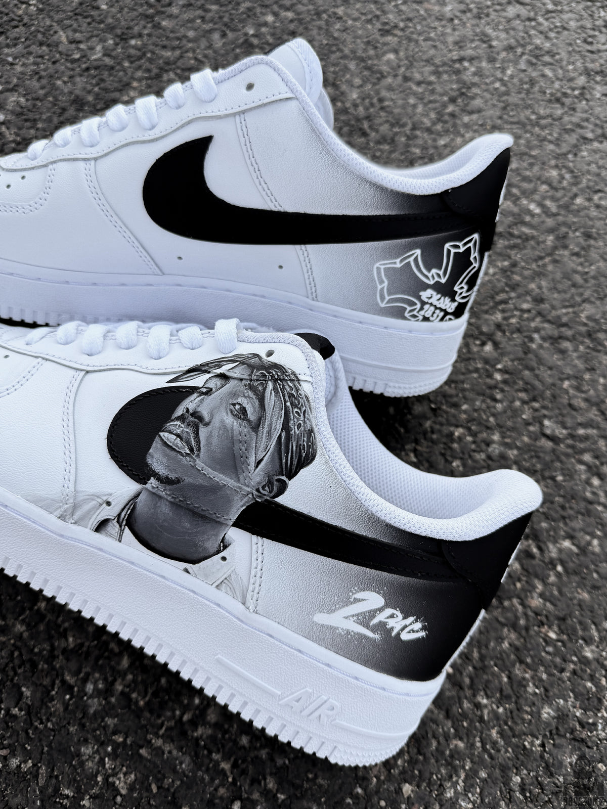 Black and white Nike Air Force 1 custom shoes featuring a realistic 2Pac portrait painted across the side panels