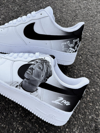 Black and white Nike Air Force 1 custom shoes featuring a realistic 2Pac portrait painted across the side panels