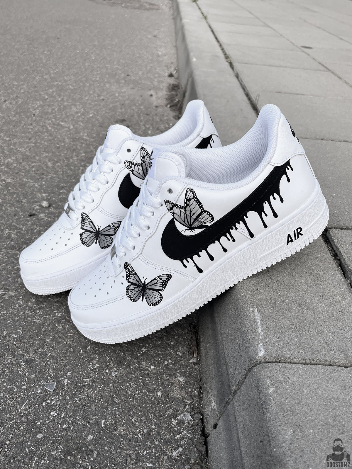 Nike Air Force 1 Drips N' Butterflies Black Custom sneakers displayed outdoors