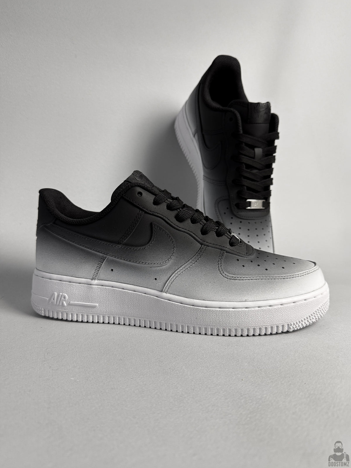 Hand-painted Nike Air Force 1 custom sneakers with black to white ombre gradient