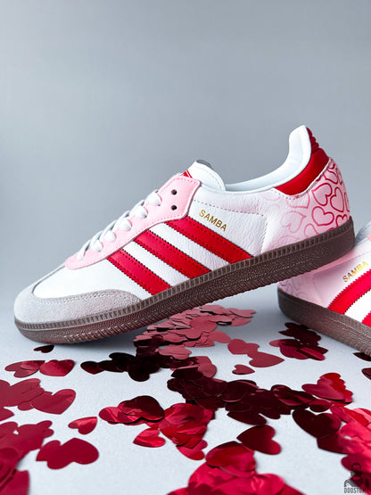 Side view of hand-painted Adidas Samba Custom sneakers with pink, red and white details